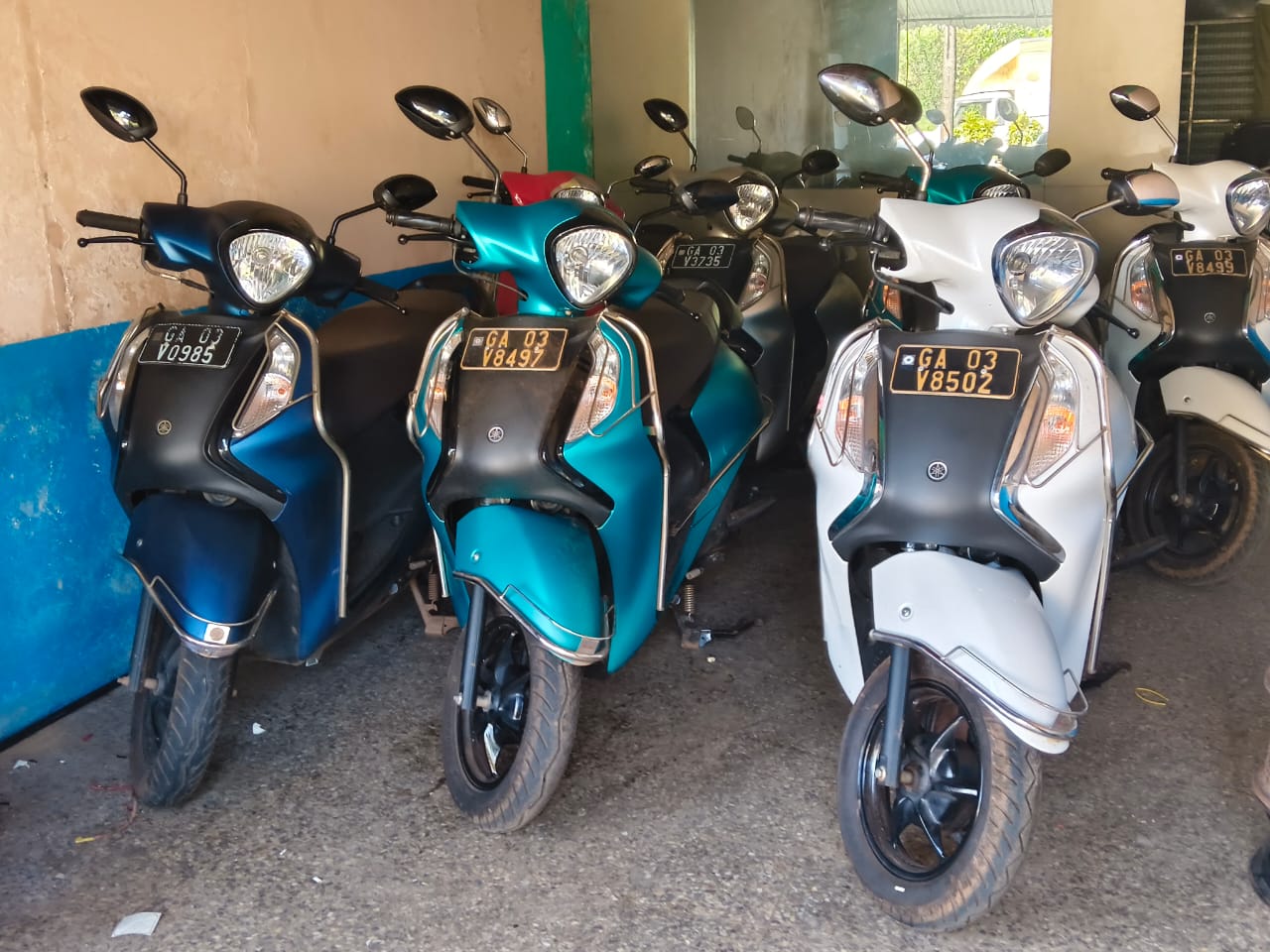 Scooters parked at the NSZ Goa Ride rental location